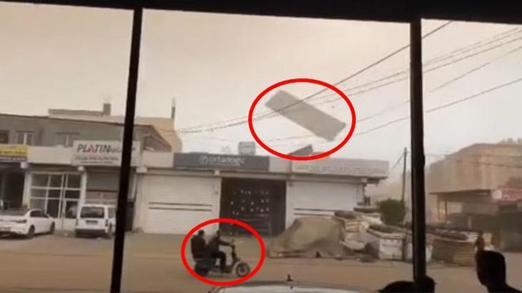 Fırtınada uçan levha tellere çarpıp yön değiştirdi! Motosikletteki 2 kişi ölümden döndü
